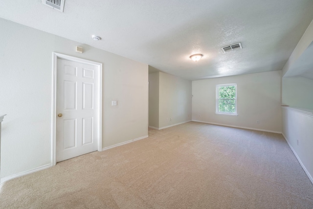 113 N W A Allen Blvd, Wylie, TX 75098 - spare room with a textured ceiling, light carpet, and a smoke detector
