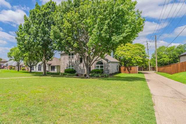 113 N W A Allen Blvd, Wylie, TX 75098 - view of property hidden behind natural elements featuring stone siding and concrete driveway