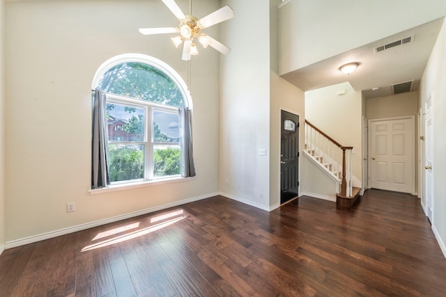 113 N W A Allen Blvd, Wylie, TX 75098 - empty room featuring stairs, wood finished floors, a high ceiling, and ceiling fan