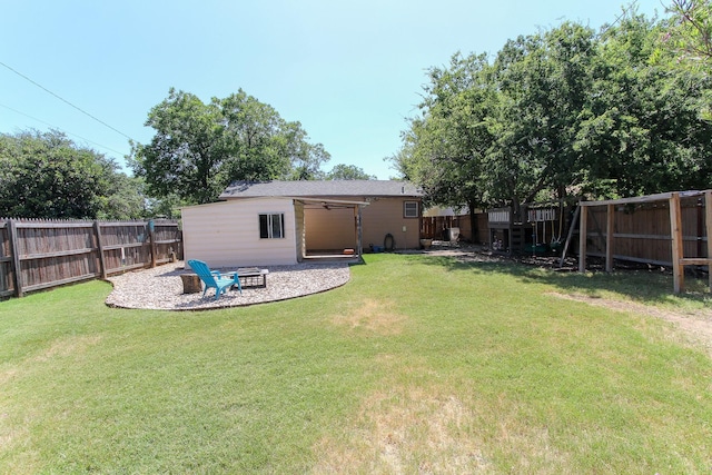1902 Matador St, Abilene, TX 79605 - fenced backyard with an outdoor fire pit and a ceiling fan