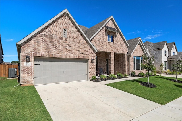 1715 Holly Oak Way, Fate, TX 75087 - french country home featuring brick siding, concrete driveway, and a garage