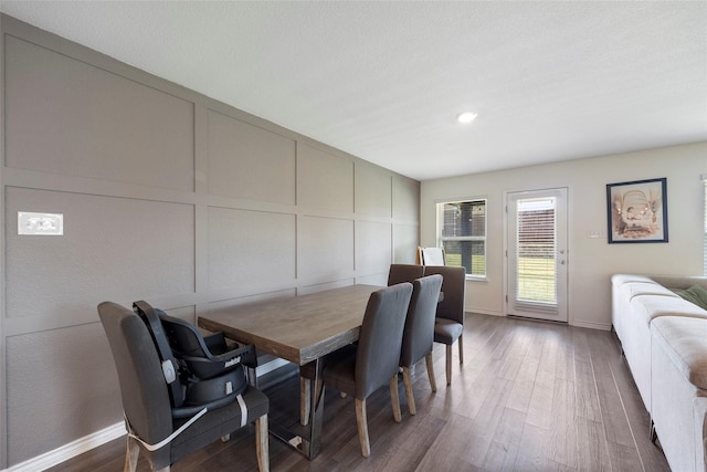 816 Adair Dr, Aubrey, TX 76227 - dining room with a decorative wall, wood finished floors, and recessed lighting