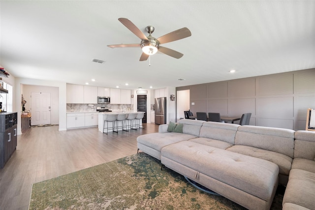 816 Adair Dr, Aubrey, TX 76227 - living room with ceiling fan, recessed lighting, and light wood-style flooring