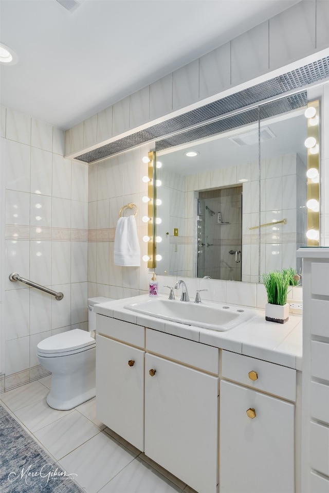 300 Pierremont Rd Unit 18, Shreveport, LA 71106 - full bathroom with tile walls, vanity, a stall shower, and tile patterned flooring
