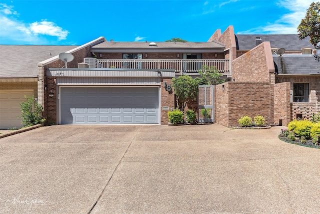 300 Pierremont Rd Unit 18, Shreveport, LA 71106 - townhome / multi-family property featuring brick siding, a balcony, and driveway