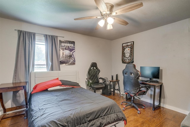 7063 Dover Ln, Richland Hills, TX 76118 - bedroom featuring wood finished floors, a ceiling fan, and an office area