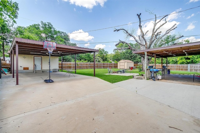 7063 Dover Ln, Richland Hills, TX 76118 - fenced backyard with a storage shed, a patio area, and a carport