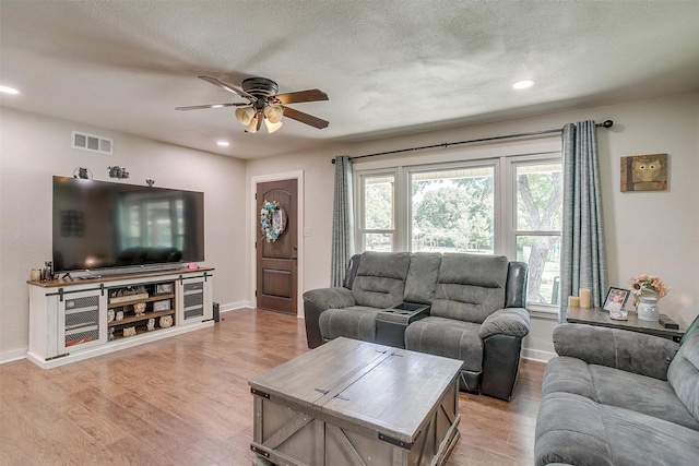 7063 Dover Ln, Richland Hills, TX 76118 - living area with ceiling fan, light wood-style floors, recessed lighting, and a textured ceiling