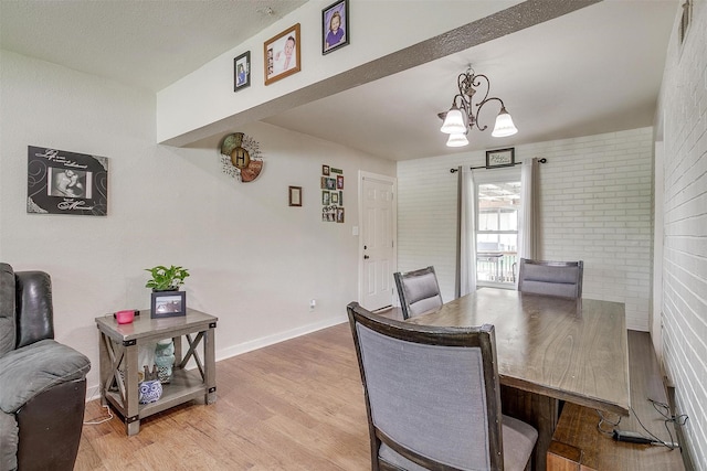 7063 Dover Ln, Richland Hills, TX 76118 - dining space featuring a chandelier and light wood-style flooring