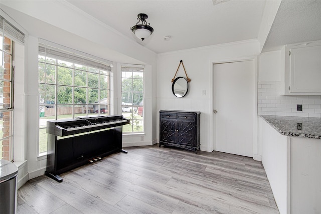 306 Country Club Dr, Joshua, TX 76058 - sitting room featuring light wood-style floors, plenty of natural light, ornamental molding, and wainscoting