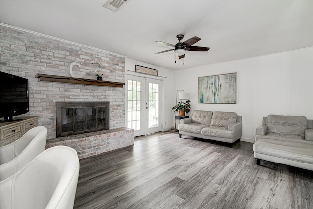 306 Country Club Dr, Joshua, TX 76058 - living room with wood finished floors, ceiling fan, and a brick fireplace