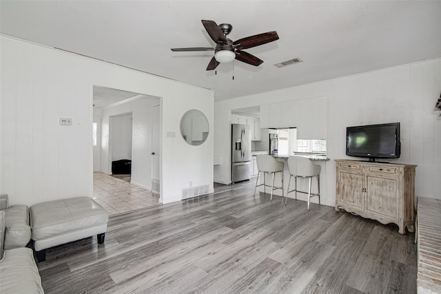 306 Country Club Dr, Joshua, TX 76058 - living room featuring a ceiling fan and light wood-style flooring