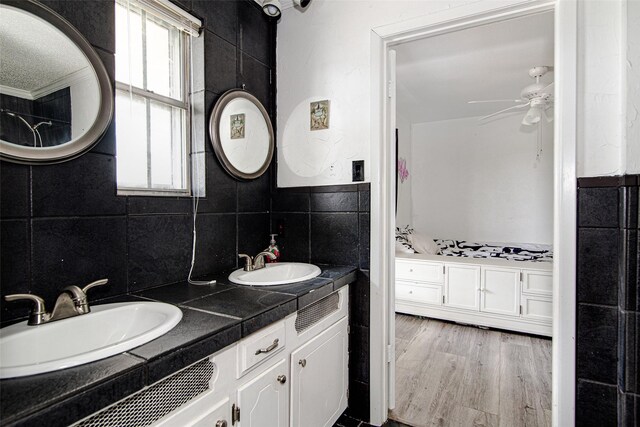 306 Country Club Dr, Joshua, TX 76058 - bathroom featuring a ceiling fan, double vanity, and wood finished floors