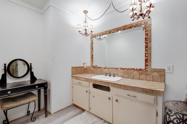 306 Country Club Dr, Joshua, TX 76058 - bathroom with a chandelier, tasteful backsplash, wood finished floors, vanity, and ornamental molding
