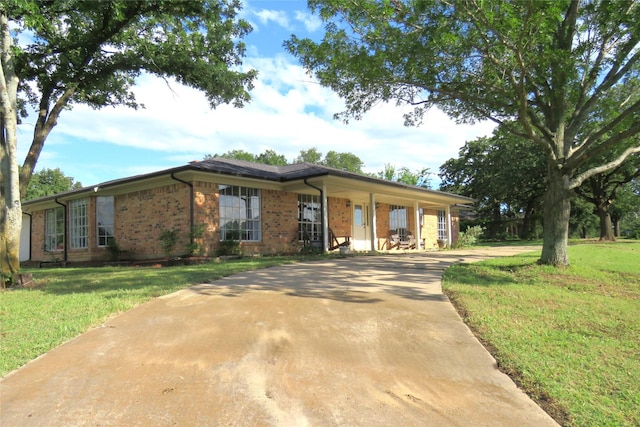 306 Country Club Dr, Joshua, TX 76058 - single story home with brick siding, a front yard, and concrete driveway