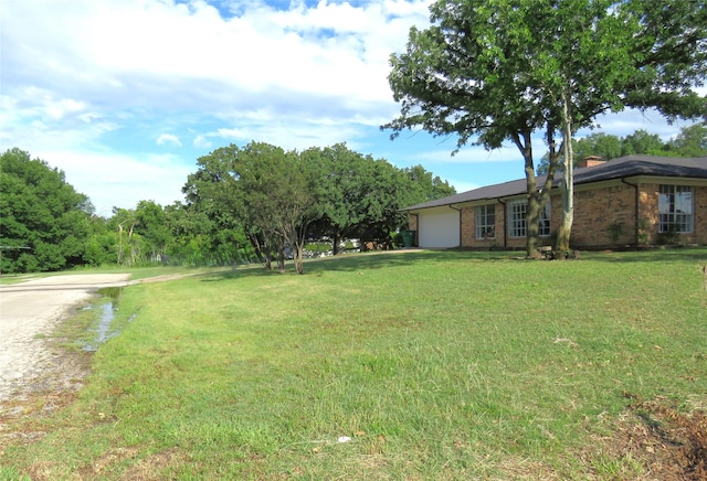306 Country Club Dr, Joshua, TX 76058 - view of grassy yard featuring an attached garage