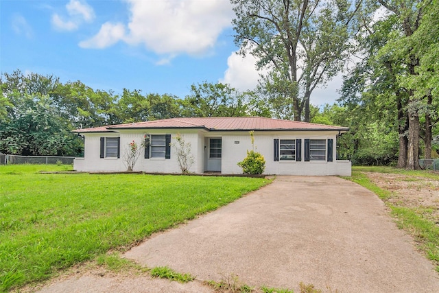 2050 Kyle Dr, Paris, TX 75460 - ranch-style house with a metal roof and driveway
