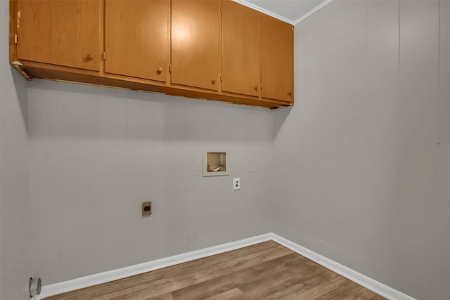 2050 Kyle Dr, Paris, TX 75460 - laundry area featuring hookup for a washing machine, electric dryer hookup, cabinet space, wood finished floors, and ornamental molding