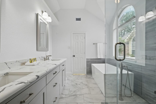 4704 Misty Ridge Dr, Fort Worth, TX 76137 - bathroom with marble finish flooring, double vanity, a freestanding tub, a shower stall, and high vaulted ceiling