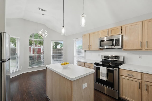 4704 Misty Ridge Dr, Fort Worth, TX 76137 - kitchen featuring stainless steel appliances, light brown cabinets, lofted ceiling, light countertops, and dark wood-type flooring
