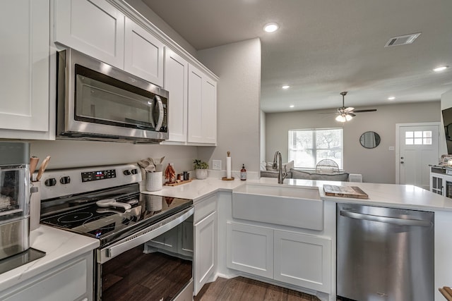 337 Hcr 1345, Hillsboro, TX 76645 - kitchen with stainless steel appliances, dark wood finished floors, white cabinetry, a ceiling fan, and recessed lighting