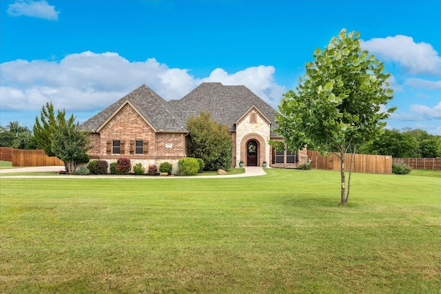 5651 Lucca Dr, Fort Worth, TX 76140 - view of front of home with brick siding and a shingled roof