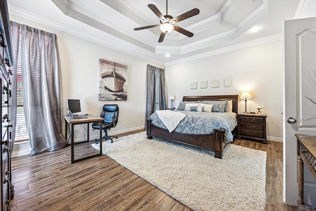 5651 Lucca Dr, Fort Worth, TX 76140 - bedroom featuring an office area, crown molding, a raised ceiling, dark wood-type flooring, and ceiling fan