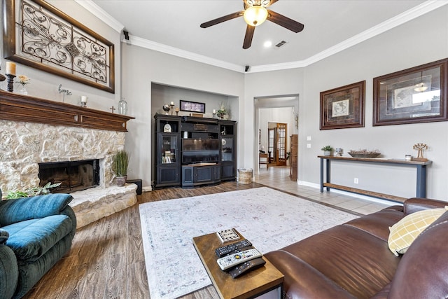 5651 Lucca Dr, Fort Worth, TX 76140 - living room with a ceiling fan, crown molding, a fireplace, and wood finished floors