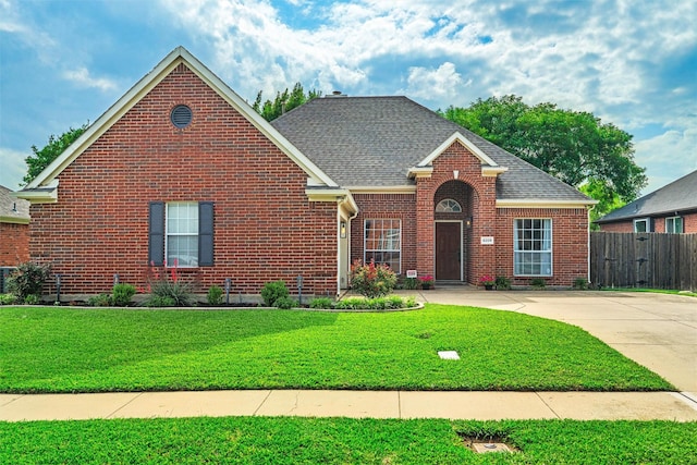 8205 Mt Mckinley Rd, Fort Worth, TX 76137 - traditional-style home featuring brick siding and roof with shingles