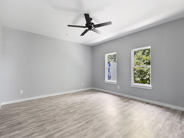 1609 E Bluff St, Fort Worth, TX 76102 - spare room with wood finished floors and ceiling fan