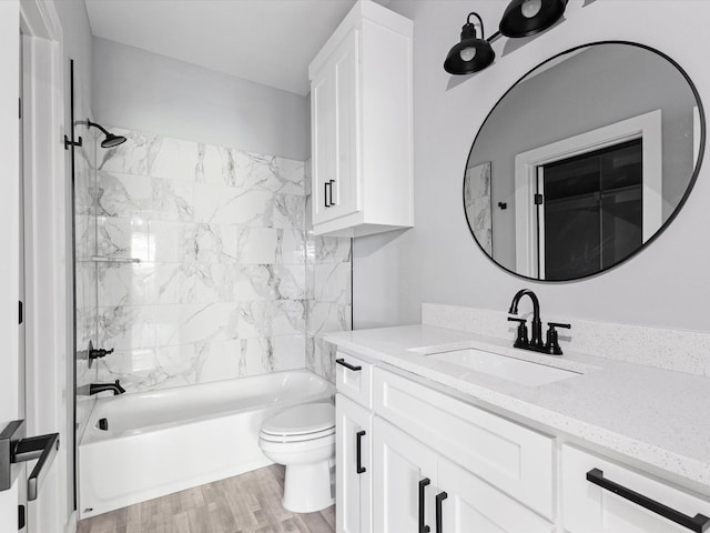 1609 E Bluff St, Fort Worth, TX 76102 - bathroom with vanity, tub / shower combination, and wood finished floors