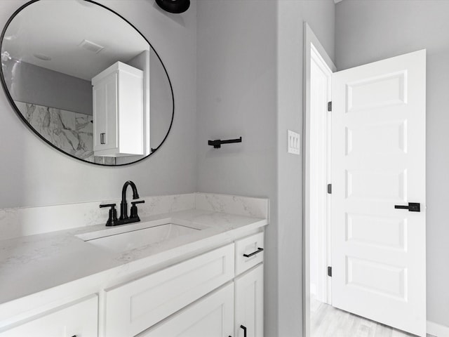 1609 E Bluff St, Fort Worth, TX 76102 - bathroom featuring vanity and wood finished floors