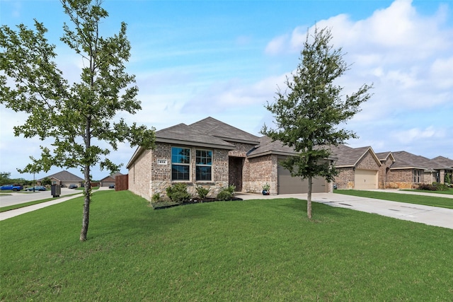 265 Atlas Dr, Waxahachie, TX 75165 - ranch-style house featuring concrete driveway, a front yard, an attached garage, stone siding, and brick siding