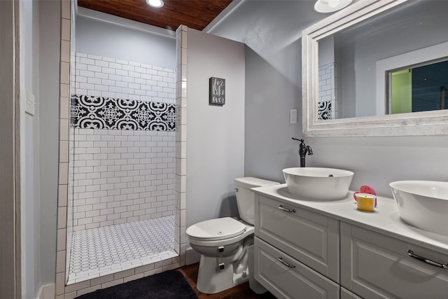 714 W Ball St, Weatherford, TX 76086 - full bathroom featuring double vanity, a tile shower, and recessed lighting