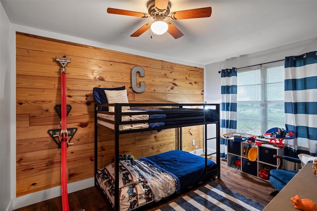 714 W Ball St, Weatherford, TX 76086 - bedroom featuring wood finished floors, ceiling fan, and wooden walls