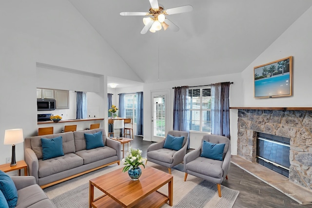 7 Atlantic Ave, Midlothian, TX 76065 - living area with high vaulted ceiling, wood finished floors, a ceiling fan, and a fireplace