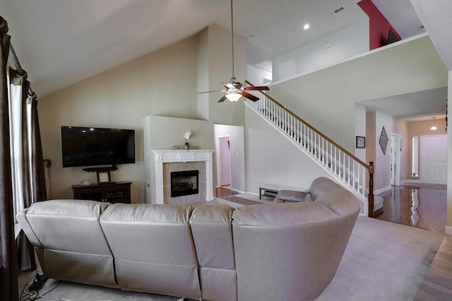 1013 Lilac Ln, Desoto, TX 75115 - living room with wood finished floors, ceiling fan, stairs, high vaulted ceiling, and a fireplace