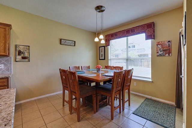1013 Lilac Ln, Desoto, TX 75115 - dining room featuring baseboards and light tile patterned flooring