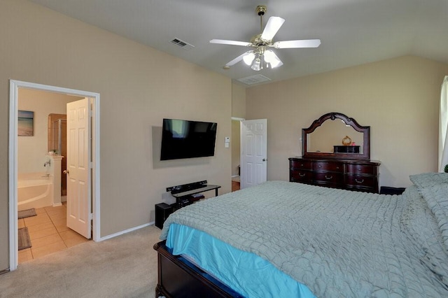 1013 Lilac Ln, Desoto, TX 75115 - bedroom with light colored carpet, a ceiling fan, vaulted ceiling, ensuite bathroom, and light tile patterned floors