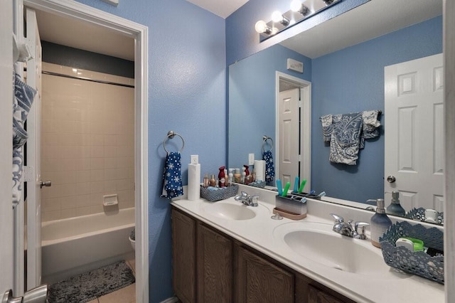 1013 Lilac Ln, Desoto, TX 75115 - bathroom with double vanity and shower / bathtub combination