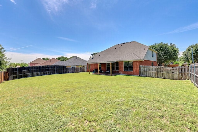 1013 Lilac Ln, Desoto, TX 75115 - back of house with brick siding and a fenced backyard