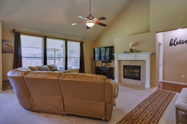 1013 Lilac Ln, Desoto, TX 75115 - living area with a ceiling fan, a fireplace, high vaulted ceiling, and light colored carpet