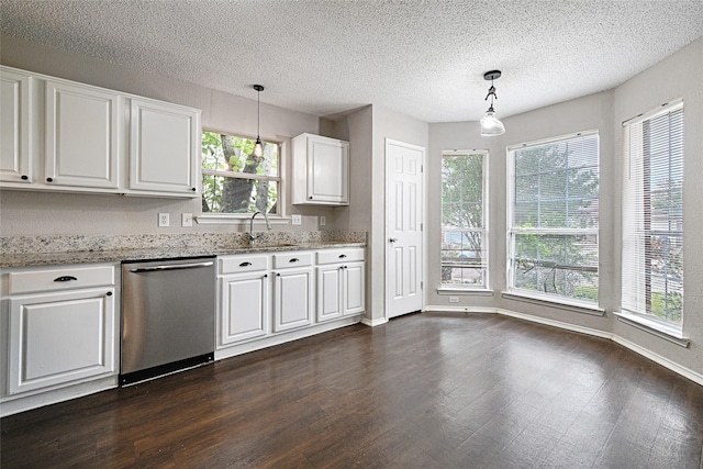 10257 Tustin Ter, Fort Worth, TX 76108 - kitchen with stainless steel dishwasher, dark wood finished floors, white cabinetry, light stone counters, and a textured ceiling