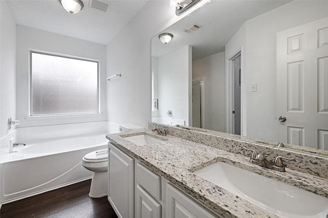 10257 Tustin Ter, Fort Worth, TX 76108 - full bath with wood finished floors, a bath, double vanity, and a stall shower