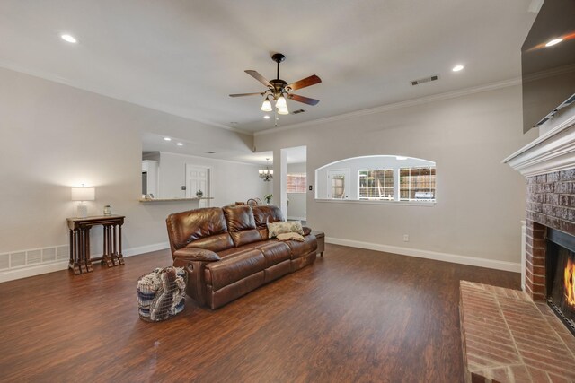 7122 Holden Dr, Rockwall, TX 75087 - living area featuring a ceiling fan, a brick fireplace, wood finished floors, recessed lighting, and crown molding
