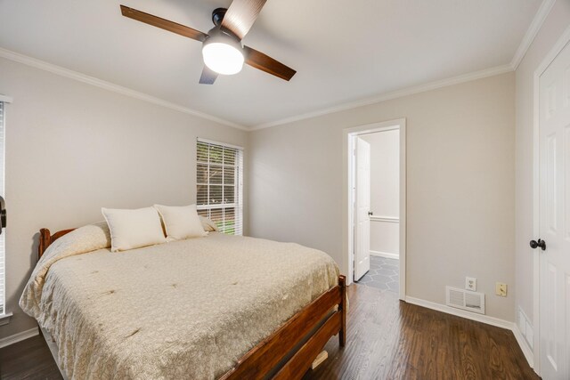 7122 Holden Dr, Rockwall, TX 75087 - bedroom featuring dark wood-style flooring, crown molding, ensuite bath, and ceiling fan