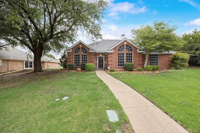 7122 Holden Dr, Rockwall, TX 75087 - view of front of home with brick siding and a front yard