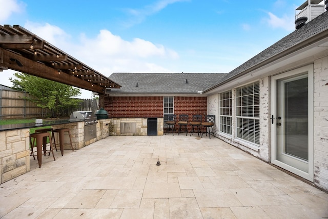 7122 Holden Dr, Rockwall, TX 75087 - view of patio with exterior kitchen and a pergola