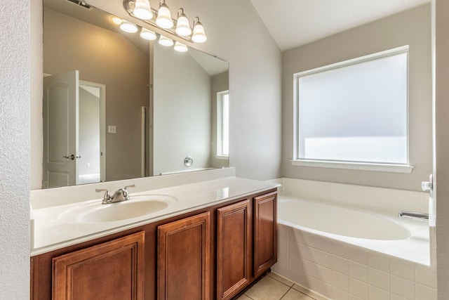 8128 Guadalupe Rd, Arlington, TX 76002 - full bath featuring vanity, a bath, and tile patterned flooring