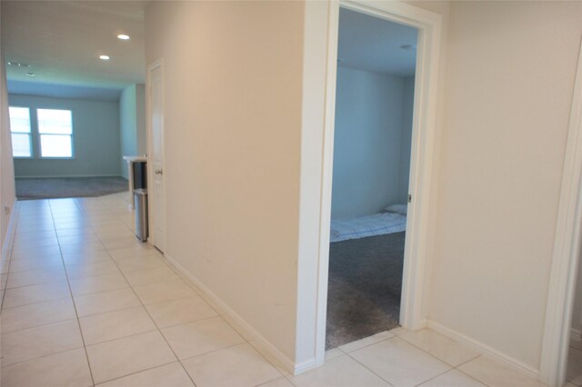 16428 Milwaukee St, Justin, TX 76247 - hallway with light tile patterned flooring and recessed lighting